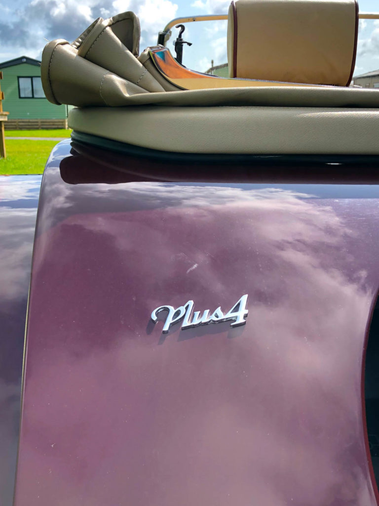 Rear panel of maroon car