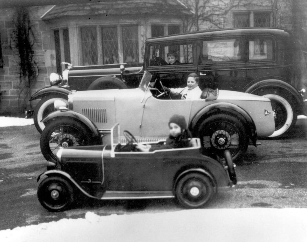 Henry Ford in America’s first MG (center), flanked by Benson and Josephine Henry Ford Museum