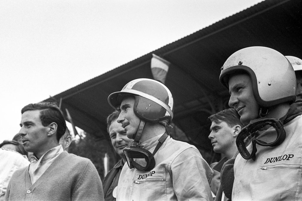 McLaren (R) at the 1965 Belgian Grand Prix, where he finished ninth in a Cooper