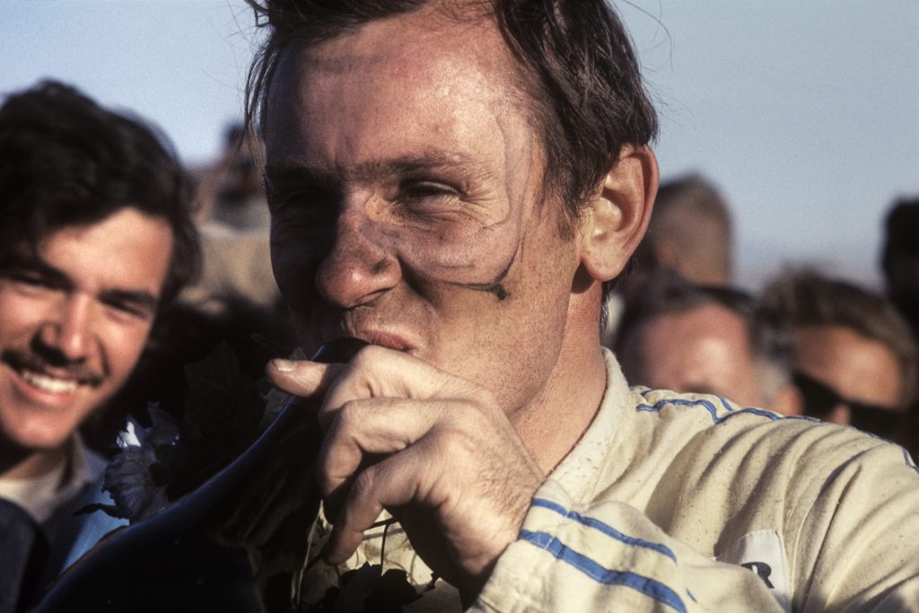 A jubilant McLaren celebrates winning the 1967 Riverside Can-Am race