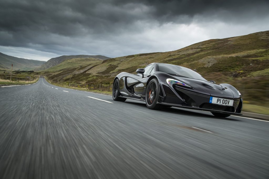 McLaren P1 front three quarter low angle driving action