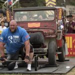 Johan Els of South Africa participates in a car deadlift competition 2018