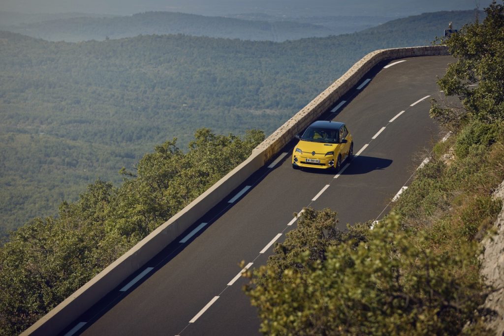 Renault 5 E-Tech driving over head long