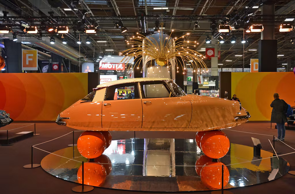 The Citroen DS balloon car on display at Retromobile 2025. Side profile.