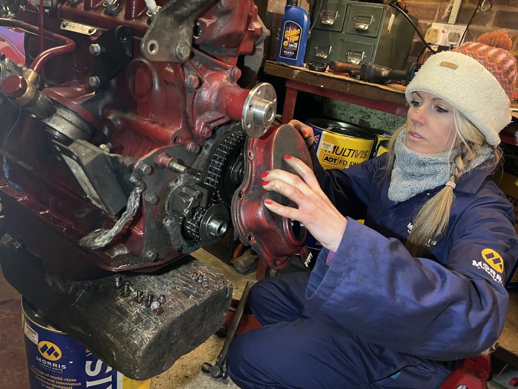 Mechanic repairing engine