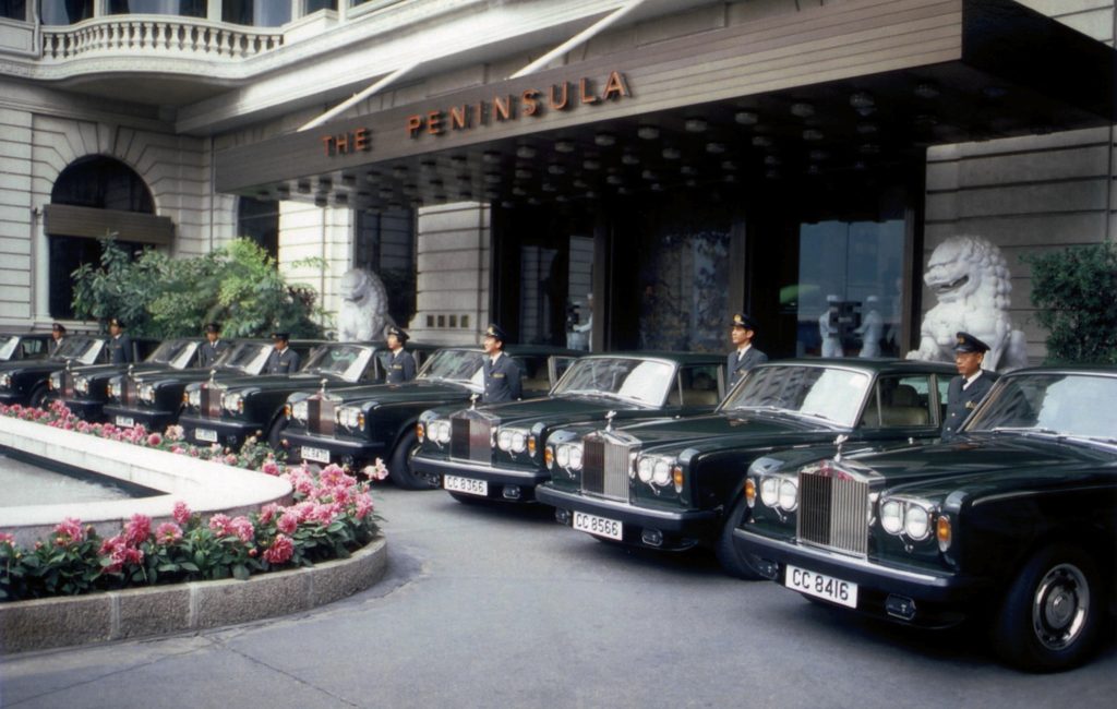Nine Rolls-Royce Silver Shadows parked outside Peninsula Hotel