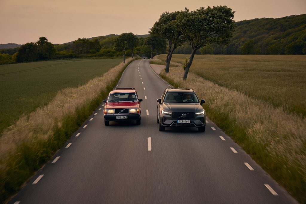 Volvo 240 and Volvo XC60 driving on road