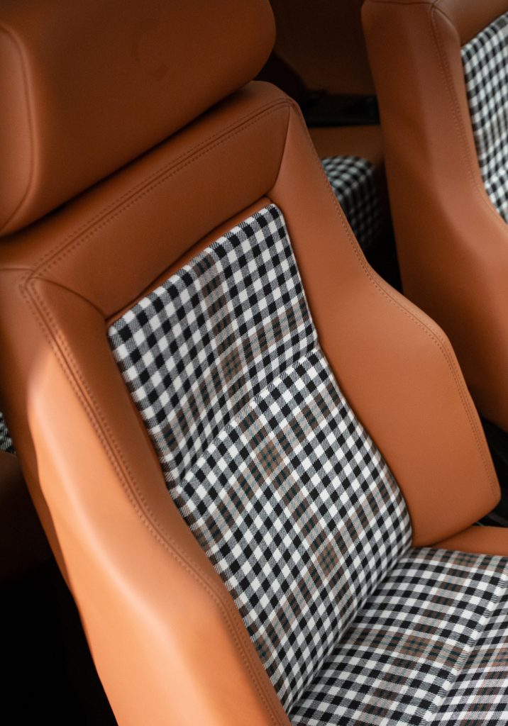 Tan leather and houndstooth front car seats