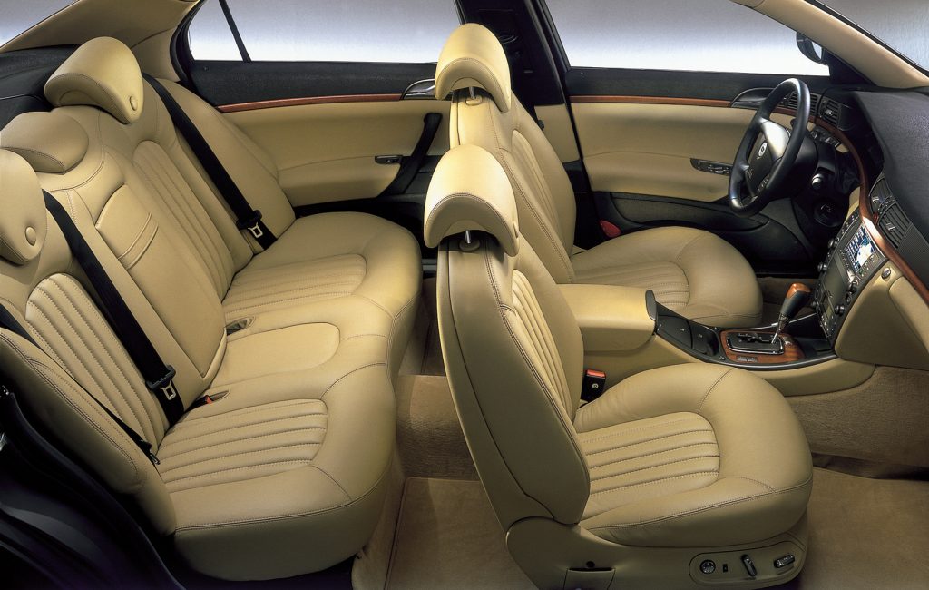 Front and rear cream leather car seats