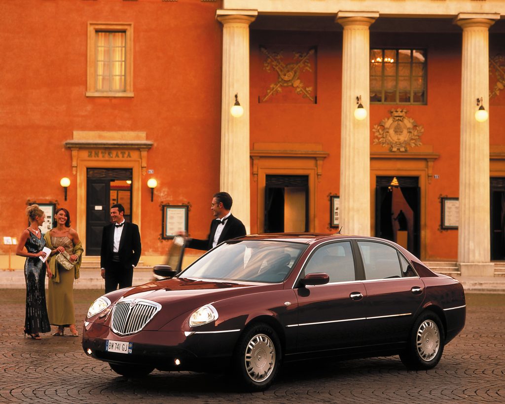 Car parked in front of stone building