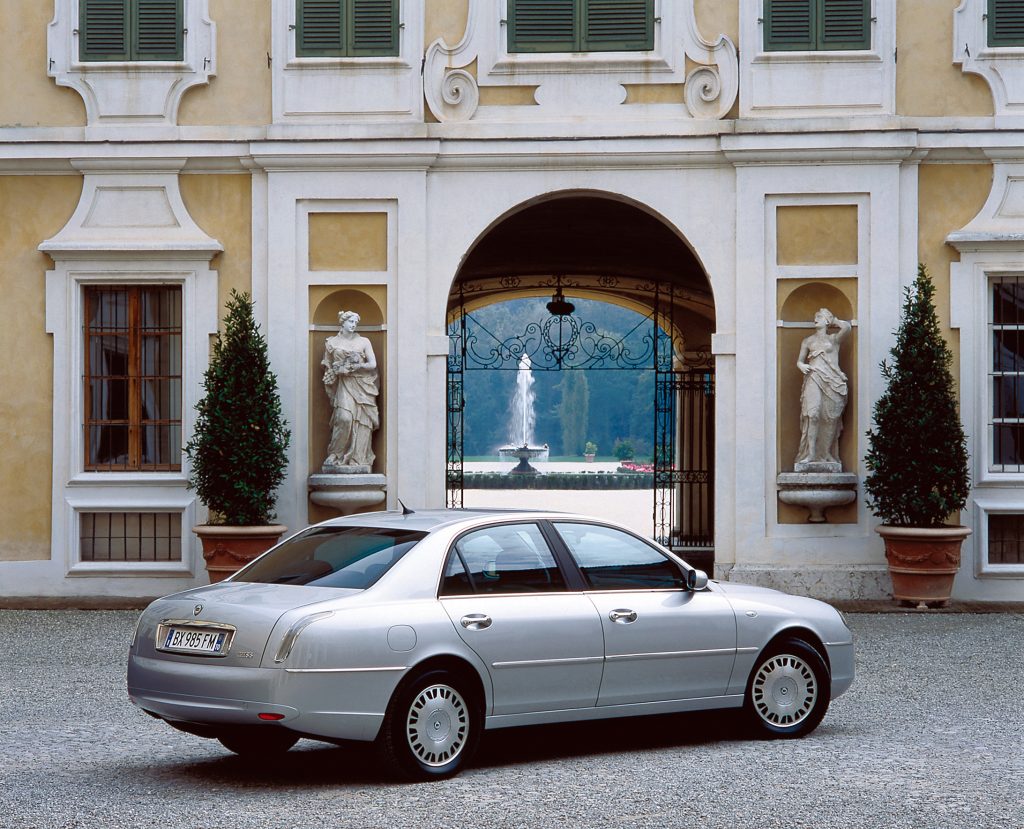 Car parked in front of stone building