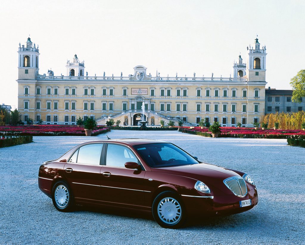 Car parked in front of stone building
