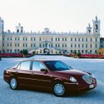 Car parked in front of stone building