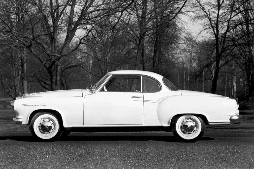 Borgward Isabella parked with woodland behind