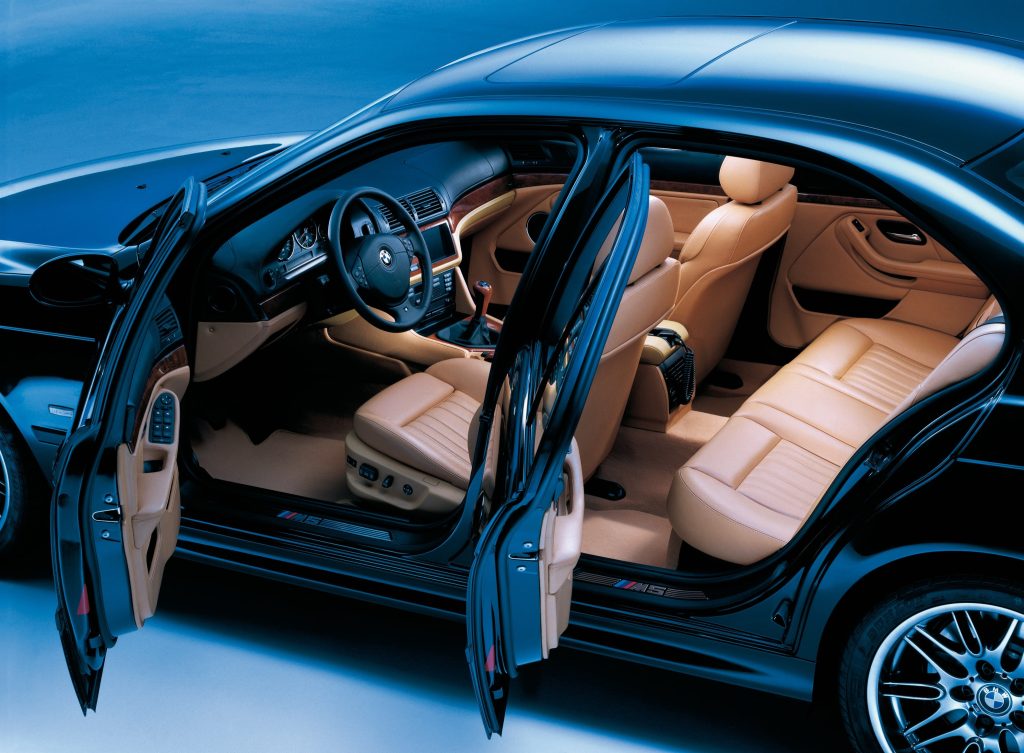 Open front and rear car doors showing interior cabin