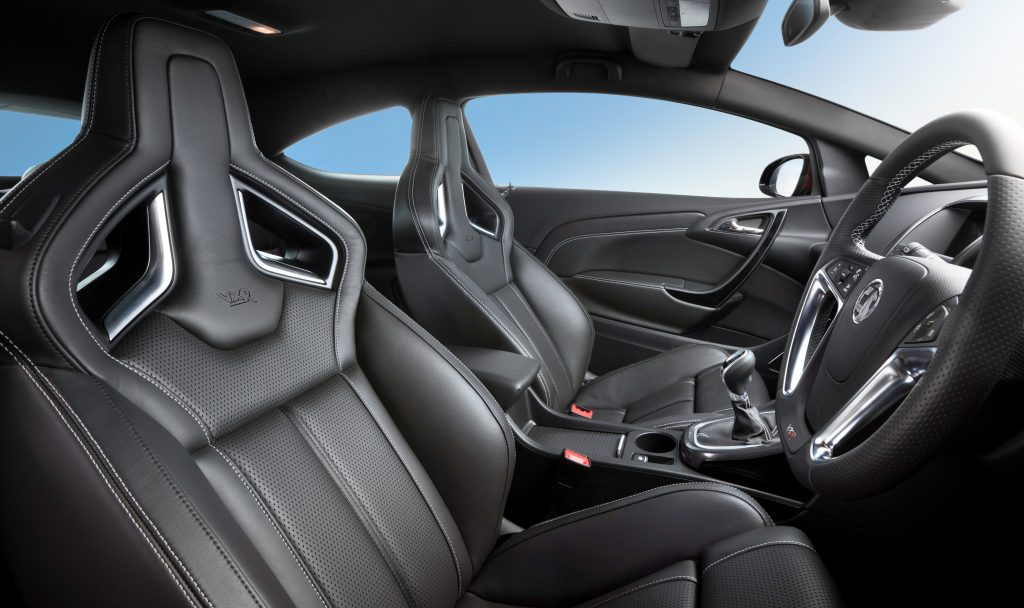 Front leather seats and steering wheel inside car