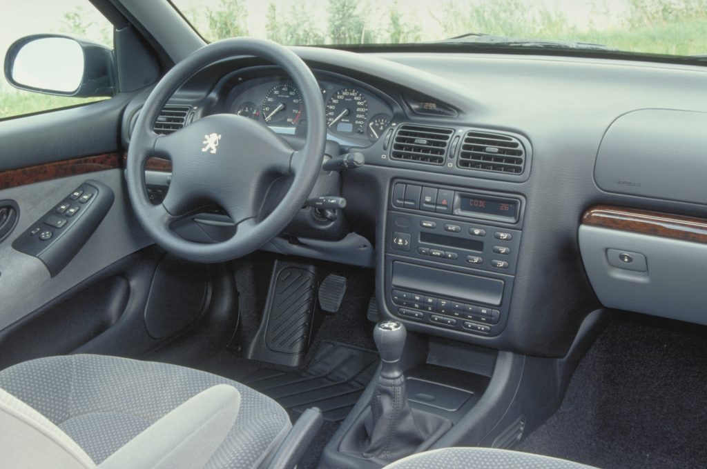 Interior shot of Peugeot 406 showing the cabin, steering wheel and front drivers seat