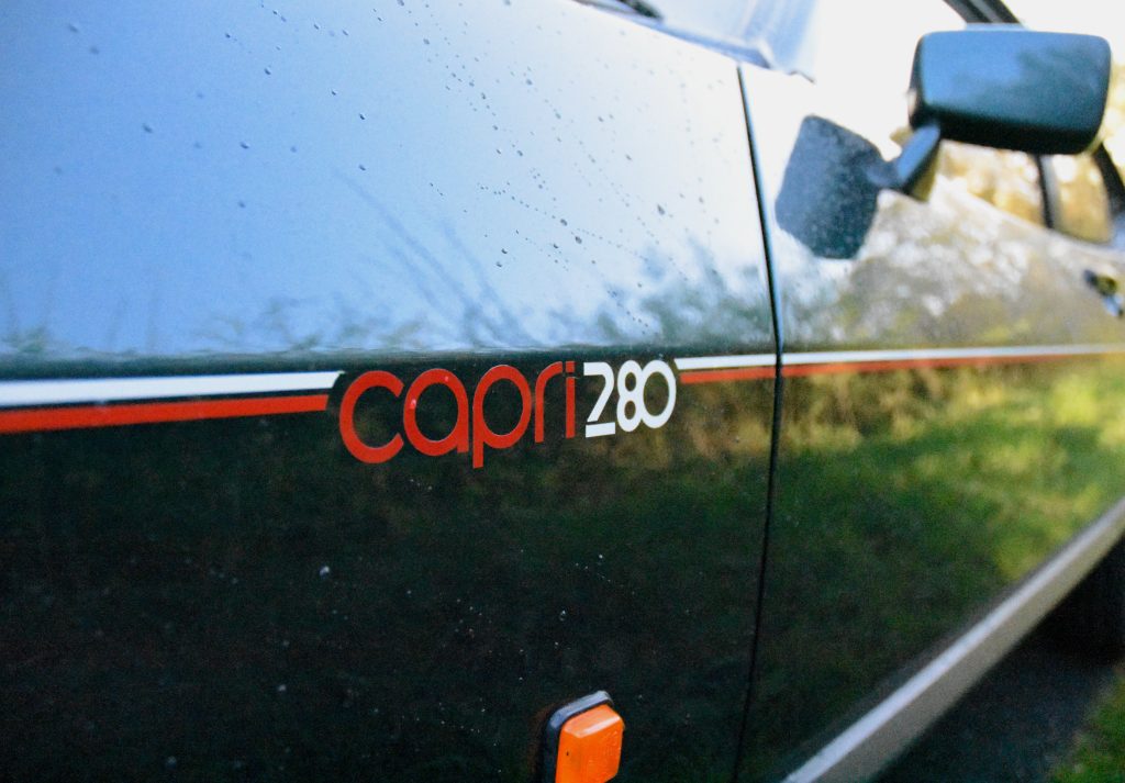 Close up of red and white decals of a Ford Capri 280