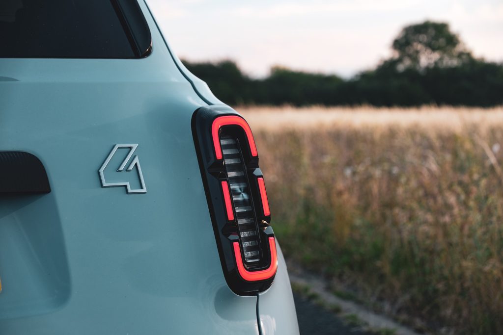 Illuminated rear light of light blue car