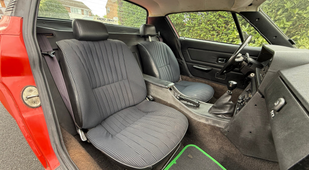 Open door of car showing inteior cabin