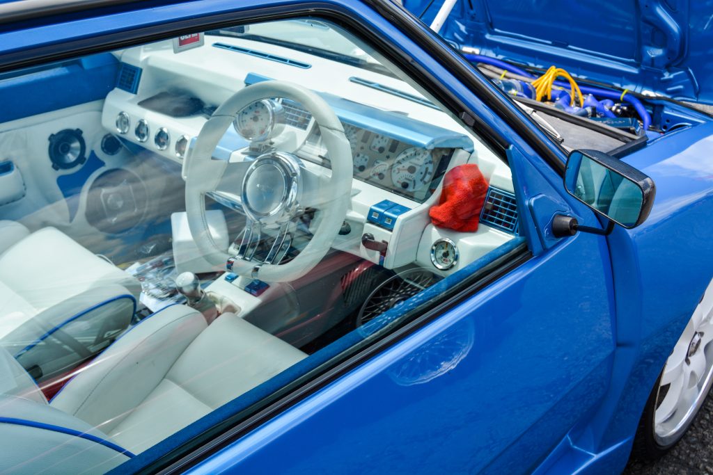 View of car interior cabin through glass window