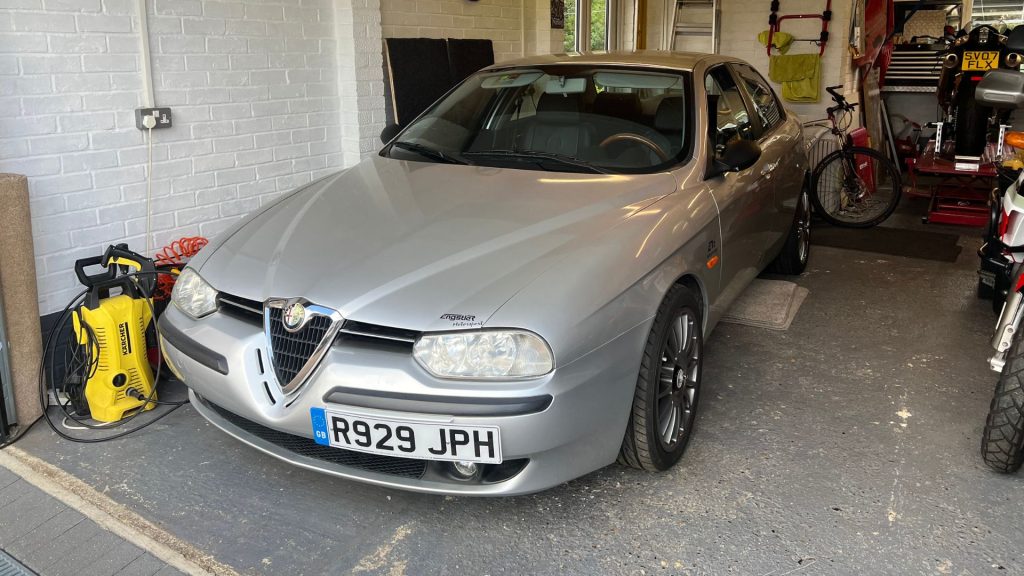 Silver Saab in garage