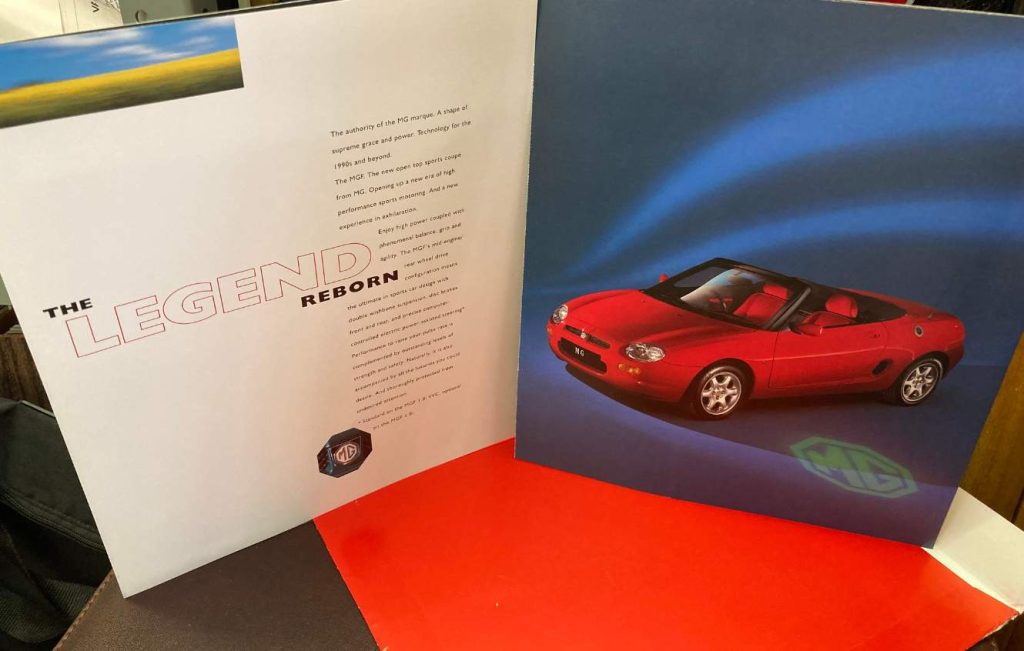 Open brochure showing a red sportscar