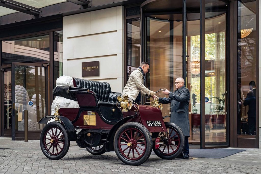 Man standing up in Knox Model C outside of the Peninsula
