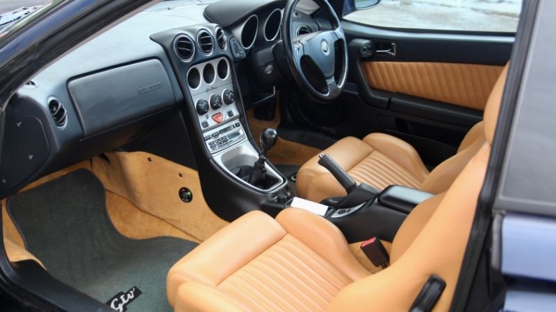 Tan leather interior of an Alfa Romeo GTV