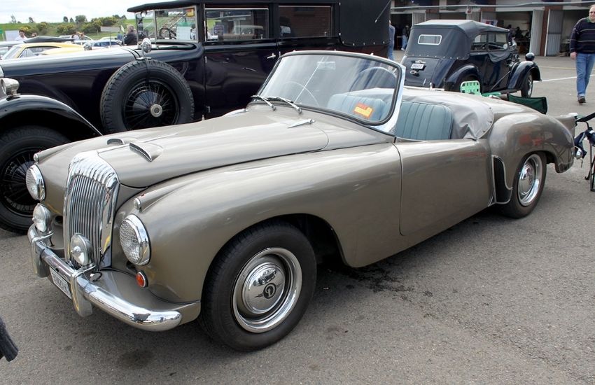 Silver convertible classic car parked in a car park