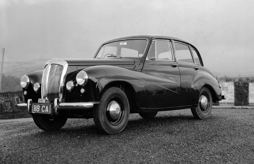 Front view of a classic car parked up