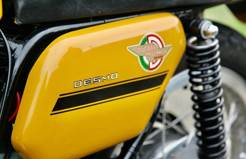 Close up of yellow Ducati Desmo fuel tank