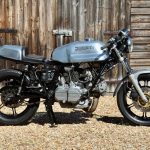 Ducati Desmo motorcycle parked up on gravel surface