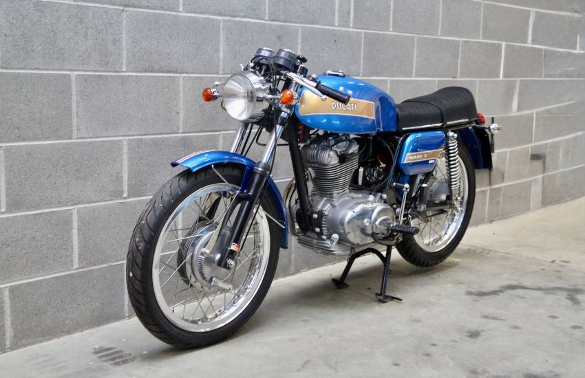 Blue Ducati Desmo motorcycle parked up