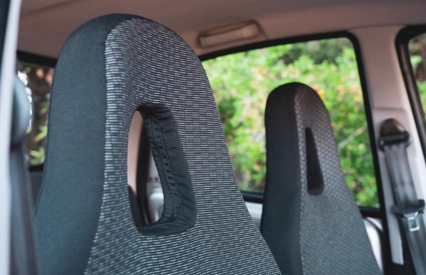 Close up of the two front patterned fabric headrests inside a car