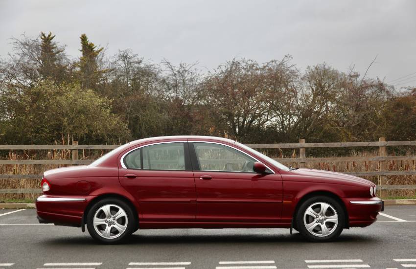 Side view of a red Jaguar X-Type