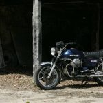 Classic motorcycle parked inside a barn