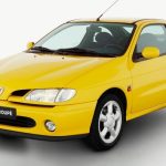 Front view of a parked yellow Renault Megane