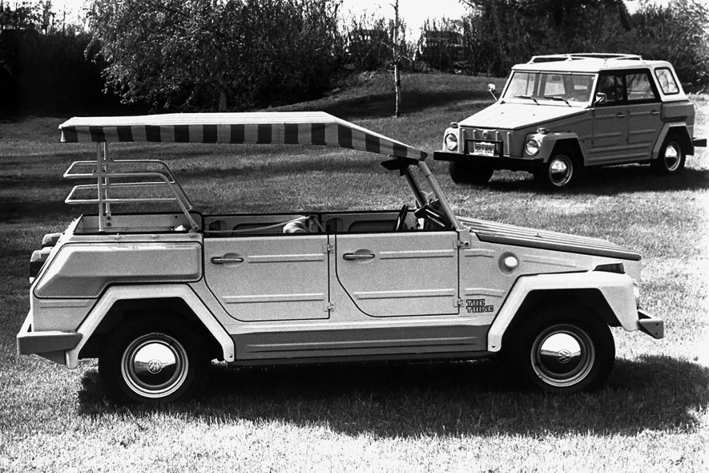 Two Volkswagen Type 181 vehicles parked in a field