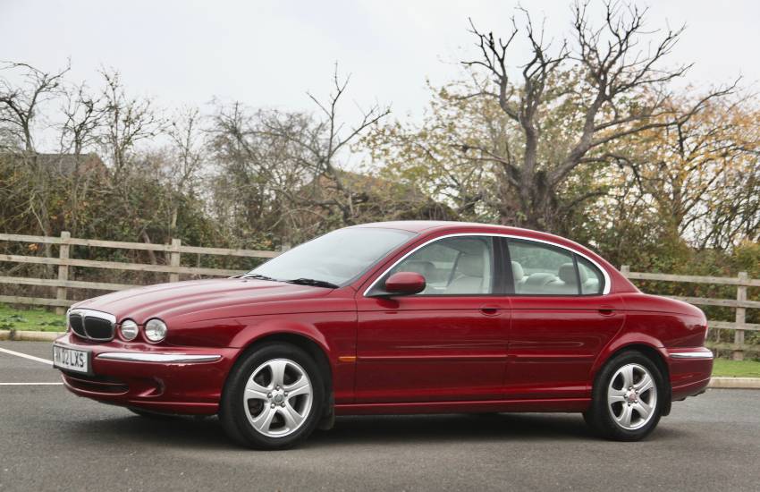 Side view of a red Jaguar X-Type