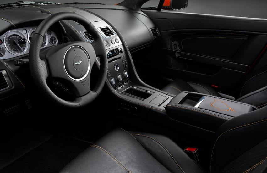 Black leather dashboard, steering wheel and front seats of a car