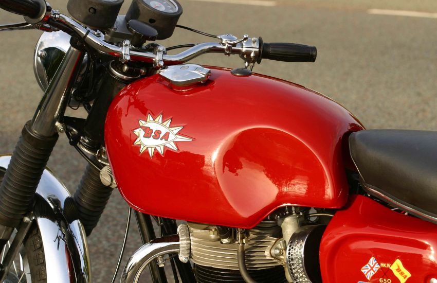 Red fuel tank of a red classic motorbike