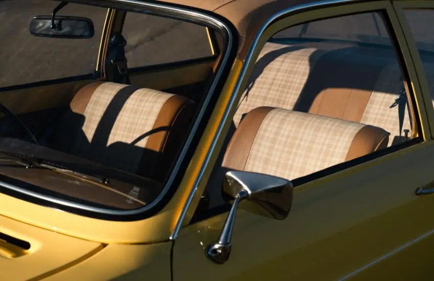 Brown leather and checkered material interior seats of a classic car