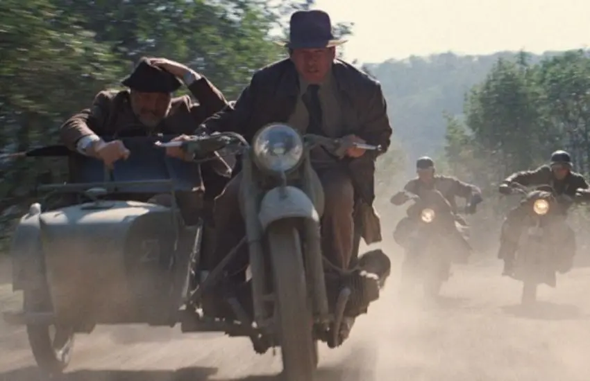 Still of a film scene with four men riding motorbikes