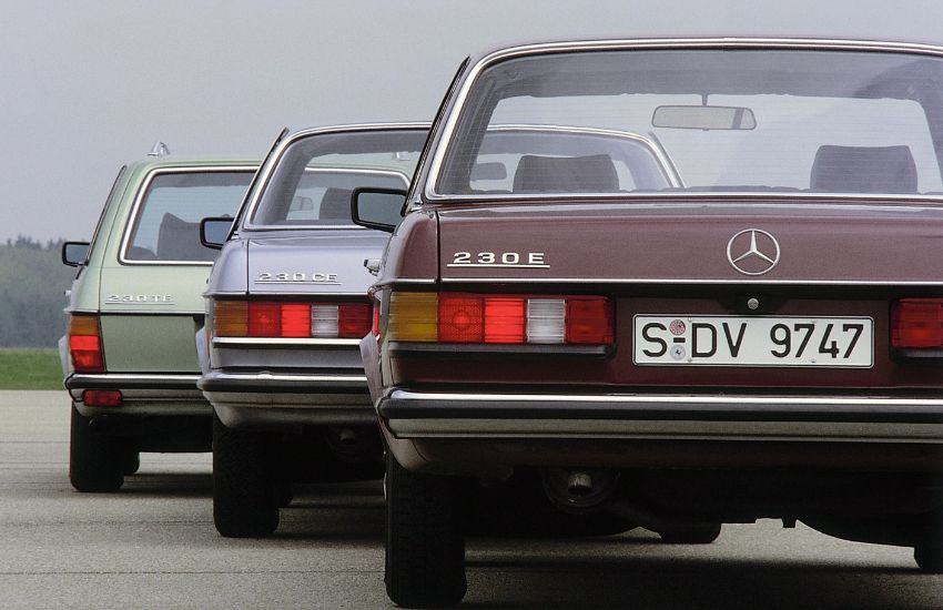 Rear view of three Mercedes-Benz W123 classic cars parked in a row