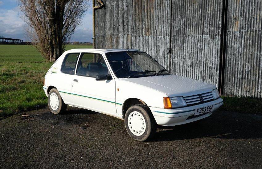 White classic car photographed from side angle demonstrating how to photograph your car