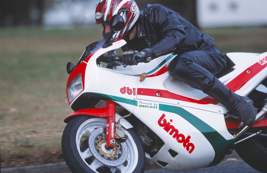 Man riding a classic motorbike at speed