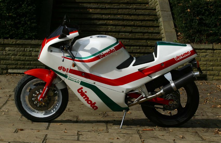 White, red and green Bimota DB1 classic motorbike parked up
