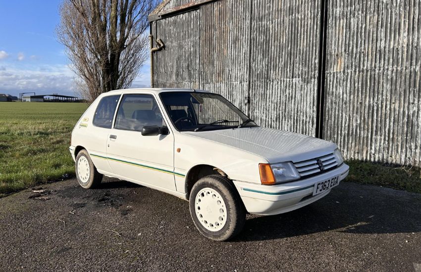 White classic car photographed from side angle demonstrating how to photograph your car