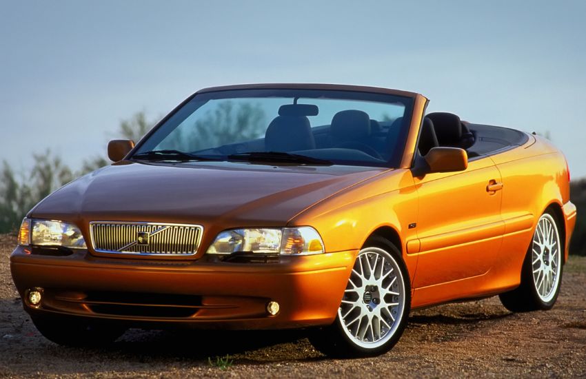 Orange convertible car parked up with the roof down